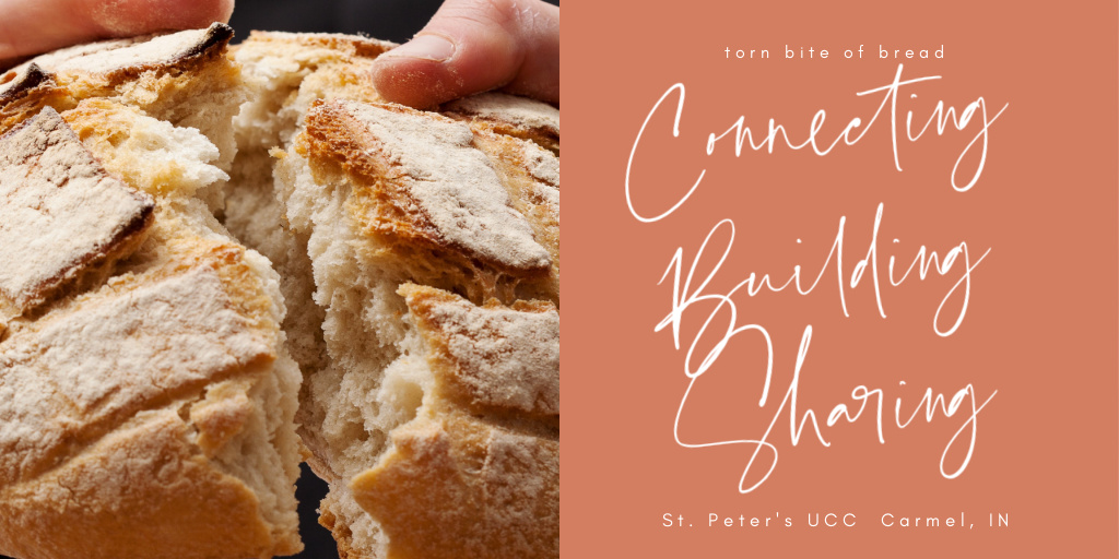 Communion bread An artisan loaf of bread being broken  in half.